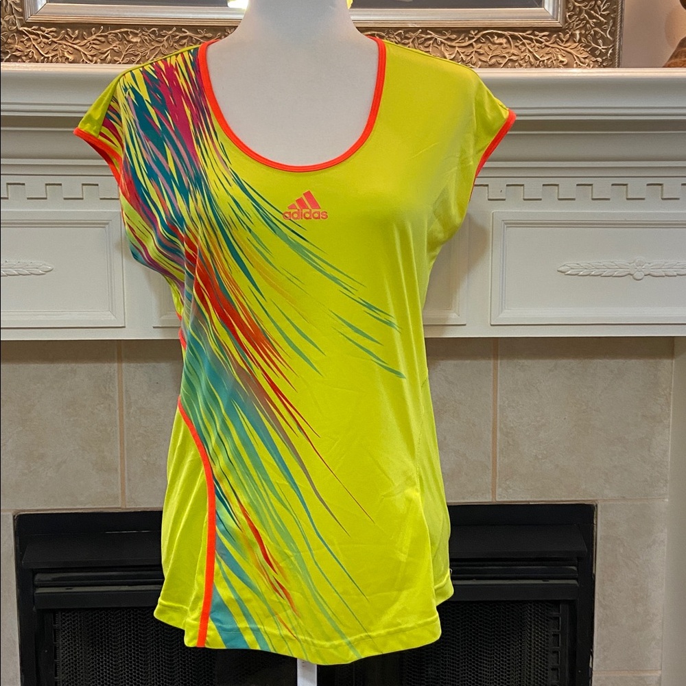 Adidas Adizero Formotion women's athletic top in neon yellow with graphic print.
